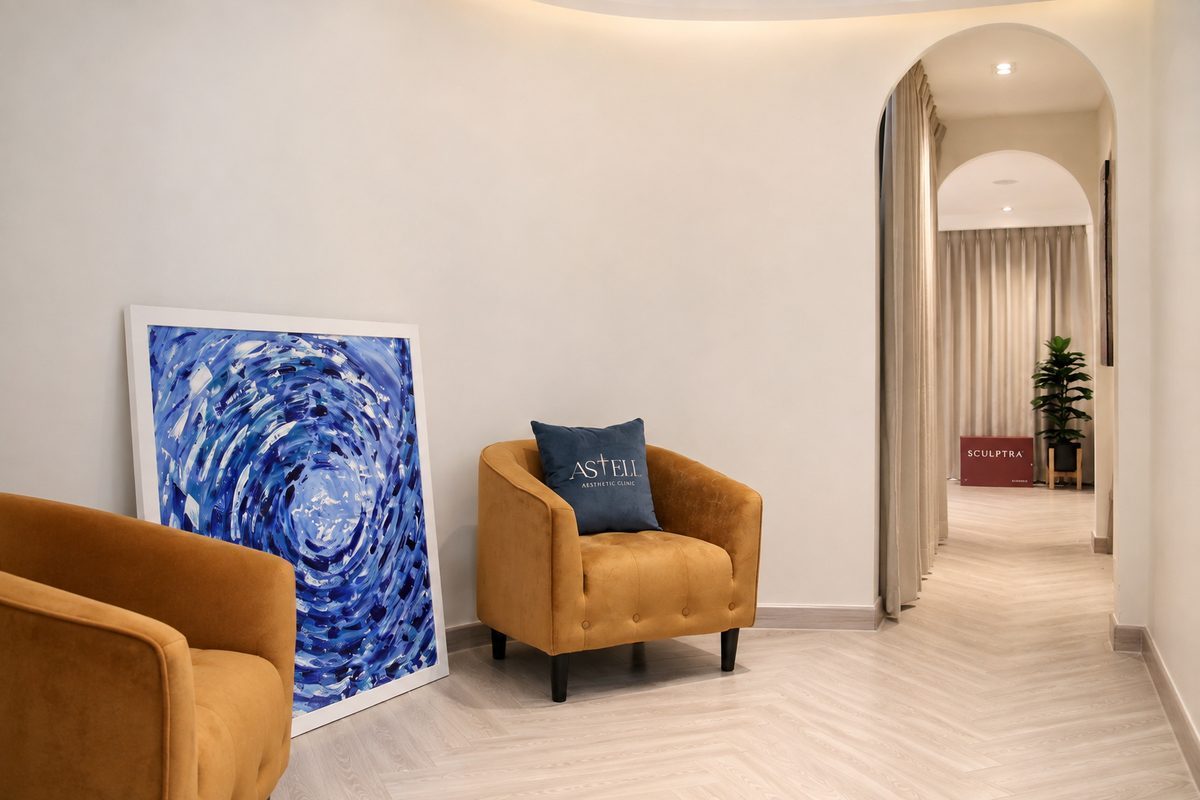 The waiting nook, with artwork and velvet armchairs