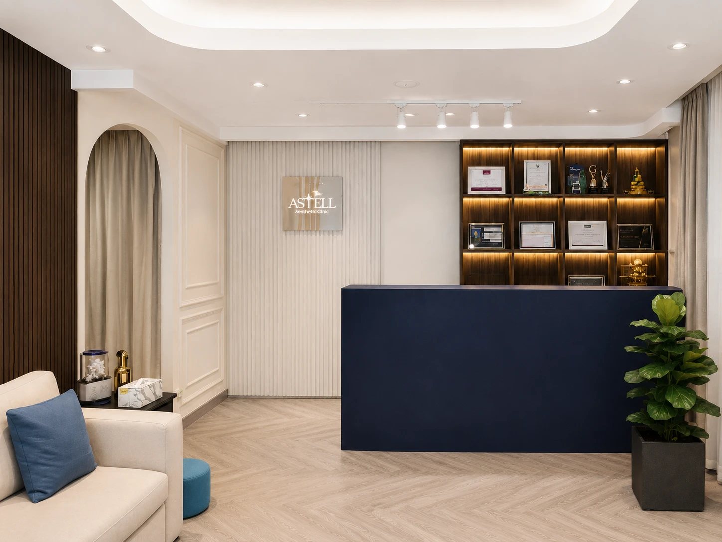 The reception at The Astell Clinic, with the clinic's awards and certificates displayed behind the desk